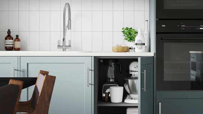 An open cupboard in a Chester Cloudy Blue Kitchen