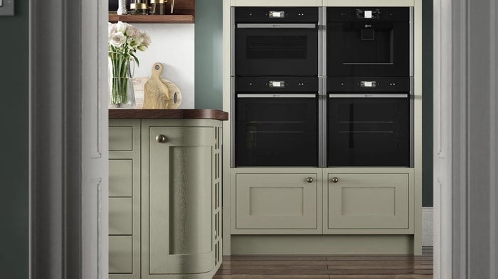 Integrated appliances in a Heritage Sage Kitchen