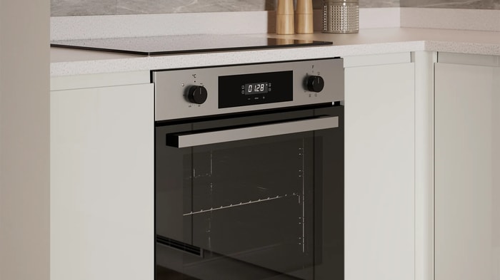 Integrated oven in a Madison Gloss Stone Kitchen