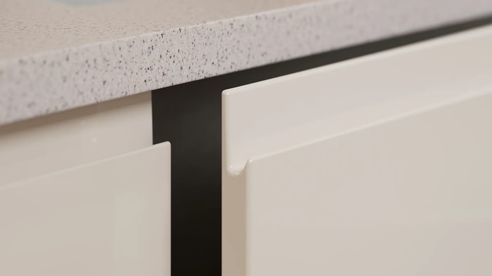 Kitchen units in a Madison Gloss Stone Kitchen