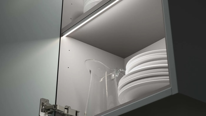 Kitchen cupboard with plates and a jug