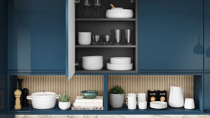 An open cupboard in a Sofia Marine Blue Kitchen