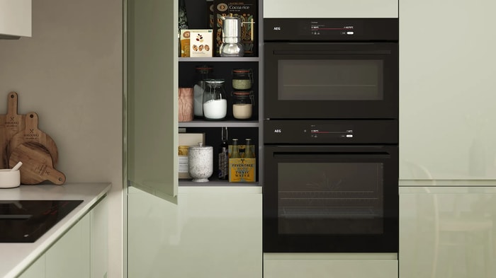 Integrated ovens in a Sofia Reed Green Kitchen