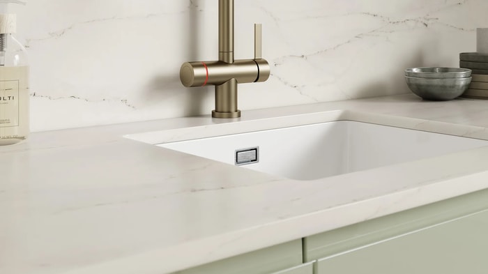 Sink and tap in a Sofia Reed Green Kitchen
